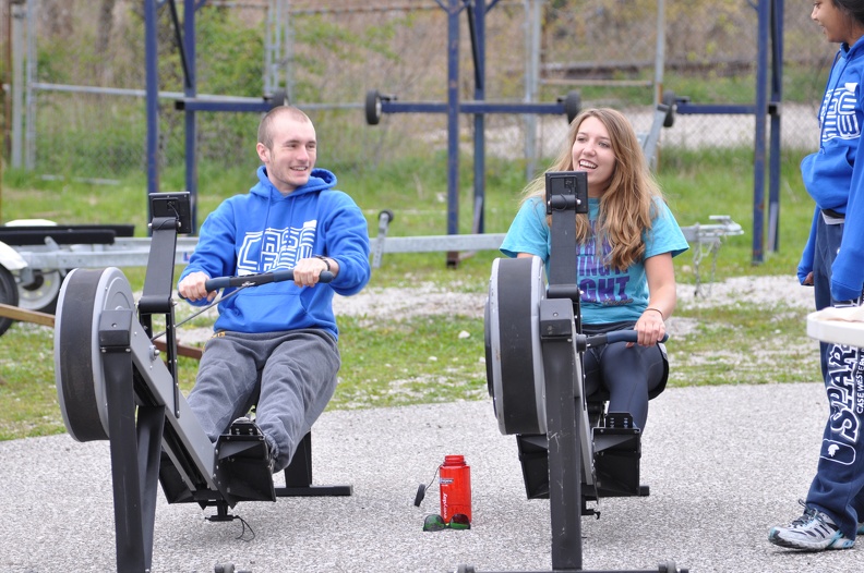 Evan and Abby warming up on the ergs.JPG